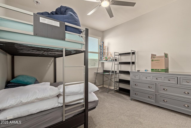 bedroom featuring ceiling fan and light carpet