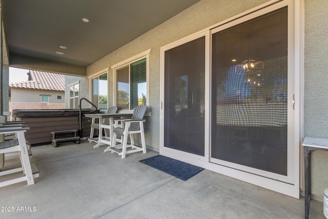 view of patio with a hot tub