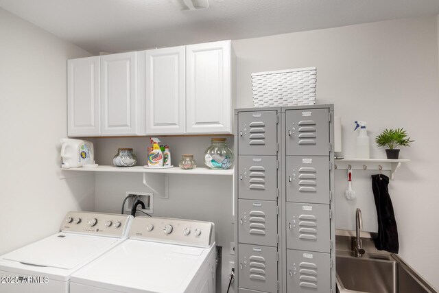 laundry area featuring cabinet space and washing machine and dryer