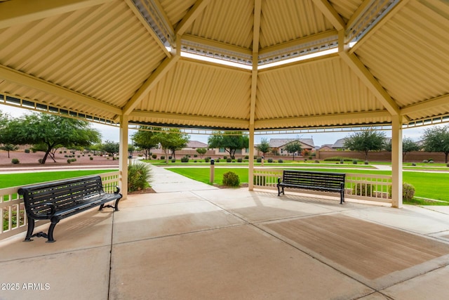 view of property's community with a yard and a gazebo