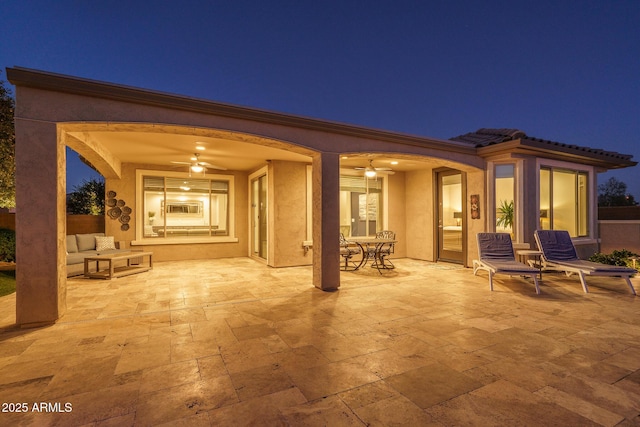 patio at night with ceiling fan