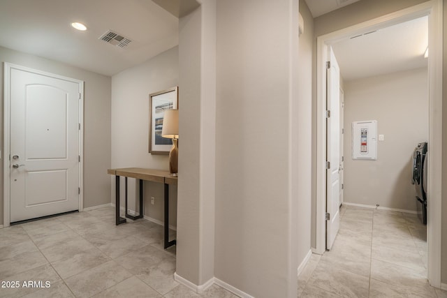 hallway featuring light tile patterned floors