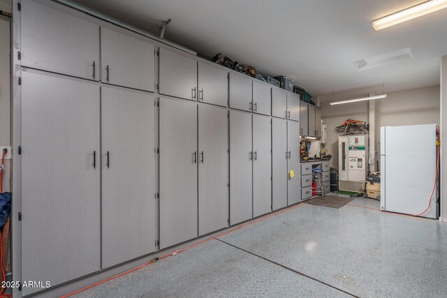 garage with white fridge