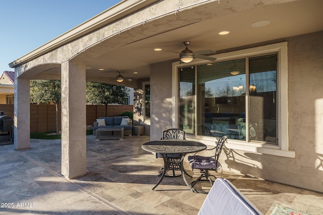 view of patio / terrace with an outdoor living space and ceiling fan