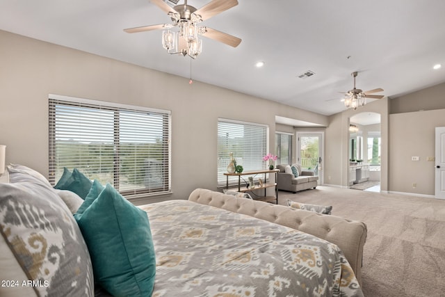 bedroom with light carpet and connected bathroom