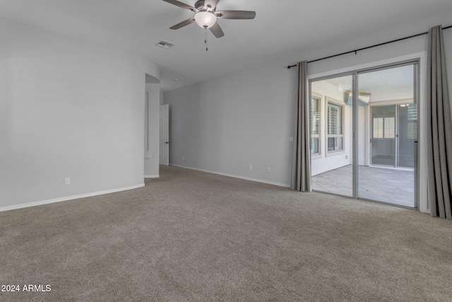 carpeted empty room featuring ceiling fan