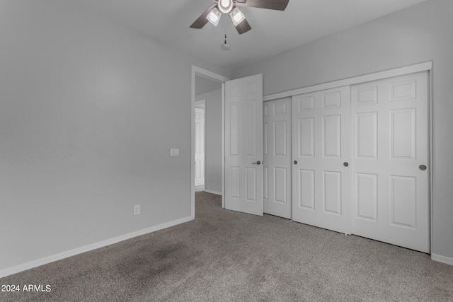 unfurnished bedroom with ceiling fan, a closet, and carpet flooring