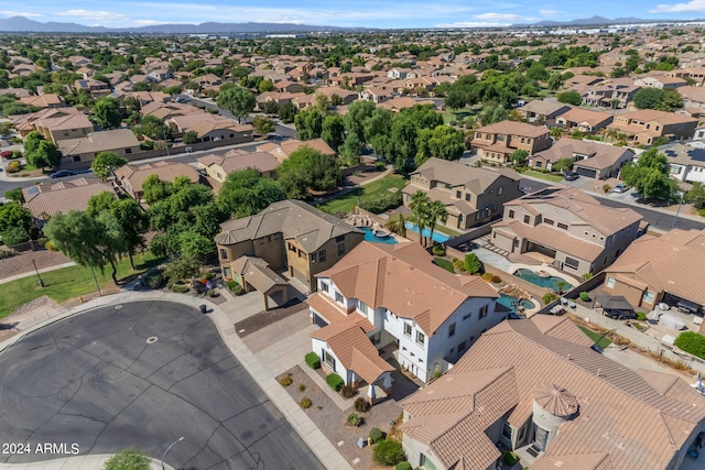 birds eye view of property featuring a mountain view