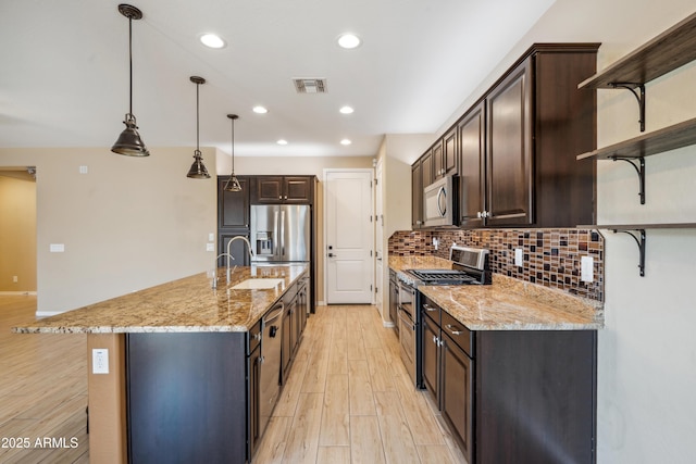 9921 E Acceleration Dr, Mesa, AZ 85212 - kitchen featuring open shelves, stainless steel appliances, a sink, dark brown cabinetry, and recessed lighting