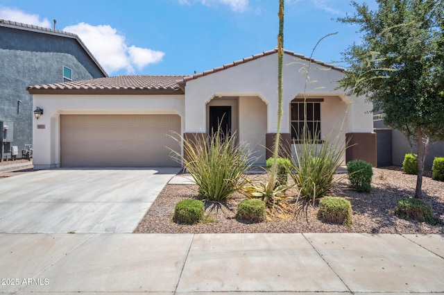 9921 E Acceleration Dr, Mesa, AZ 85212 - mediterranean / spanish-style home with stucco siding, an attached garage, driveway, and a tiled roof