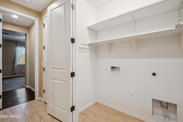 9921 E Acceleration Dr, Mesa, AZ 85212 - laundry room with gas dryer hookup, hookup for a washing machine, baseboards, light wood-style floors, and electric dryer hookup