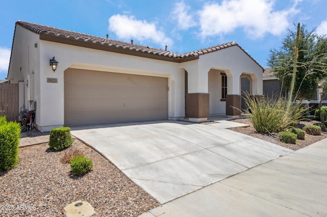 9921 E Acceleration Dr, Mesa, AZ 85212 - mediterranean / spanish-style house with stucco siding, concrete driveway, and a garage