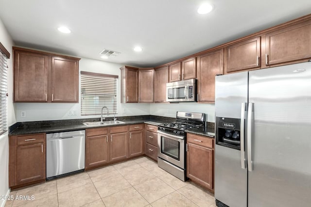 kitchen with recessed lighting, visible vents, appliances with stainless steel finishes, and a sink