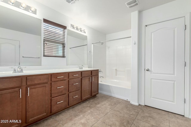 bathroom featuring visible vents, a sink, shower / bathtub combination, and double vanity