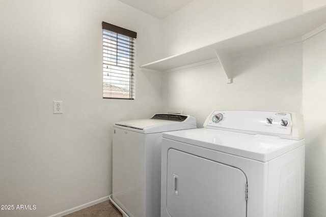 laundry area featuring laundry area, washer and dryer, and baseboards