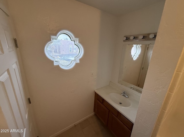 16602 N 25th St Unit 217, Phoenix, AZ 85032 - bathroom with vanity, tile patterned floors, and baseboards