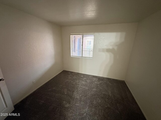 16602 N 25th St Unit 217, Phoenix, AZ 85032 - unfurnished room featuring carpet flooring and baseboards