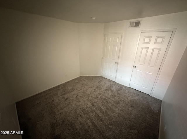 16602 N 25th St Unit 217, Phoenix, AZ 85032 - unfurnished bedroom featuring carpet floors and baseboards