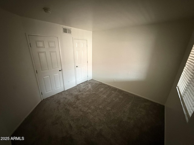 16602 N 25th St Unit 217, Phoenix, AZ 85032 - unfurnished bedroom featuring carpet flooring and baseboards