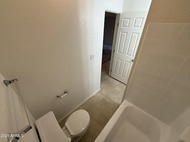 16602 N 25th St Unit 217, Phoenix, AZ 85032 - full bathroom featuring toilet, tile patterned floors, and a textured wall