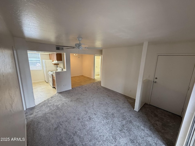 16602 N 25th St Unit 217, Phoenix, AZ 85032 - unfurnished living room with light carpet and ceiling fan
