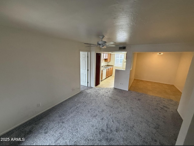 16602 N 25th St Unit 217, Phoenix, AZ 85032 - unfurnished living room featuring light carpet and ceiling fan