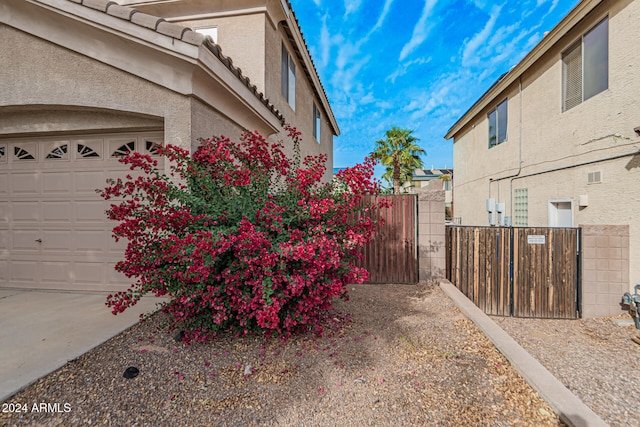 view of property exterior featuring a garage