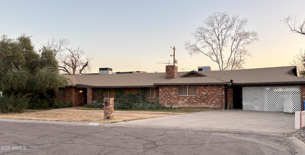 single story home featuring cooling unit