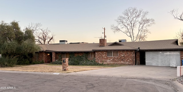 single story home featuring cooling unit