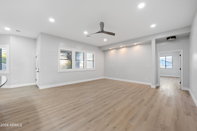 unfurnished living room featuring light hardwood / wood-style floors and ceiling fan