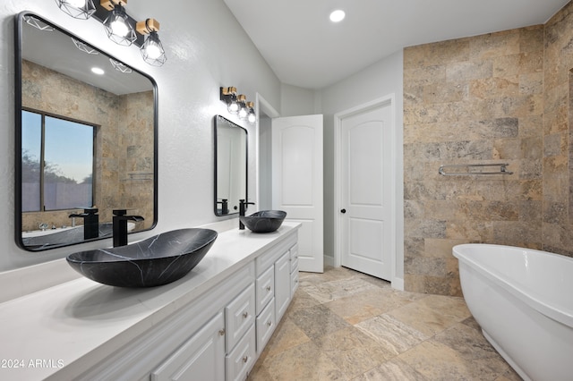 bathroom featuring vanity and a bathtub