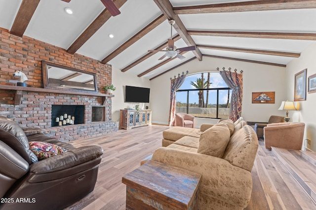 living room with vaulted ceiling with beams, ceiling fan, recessed lighting, light wood-style flooring, and a fireplace