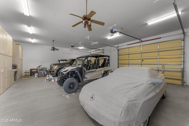 garage with a ceiling fan and a garage door opener