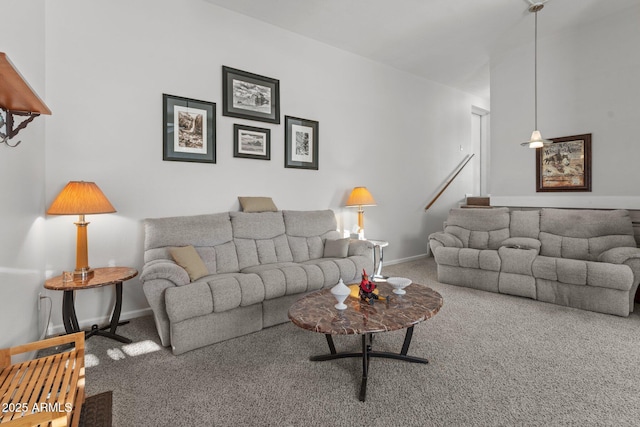 living room featuring carpet flooring and baseboards