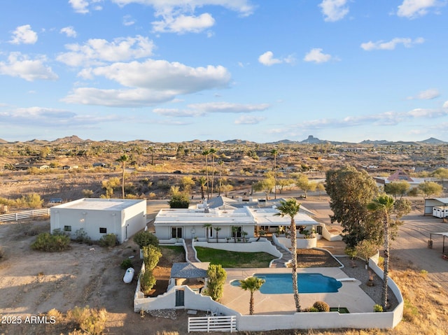 birds eye view of property with a mountain view