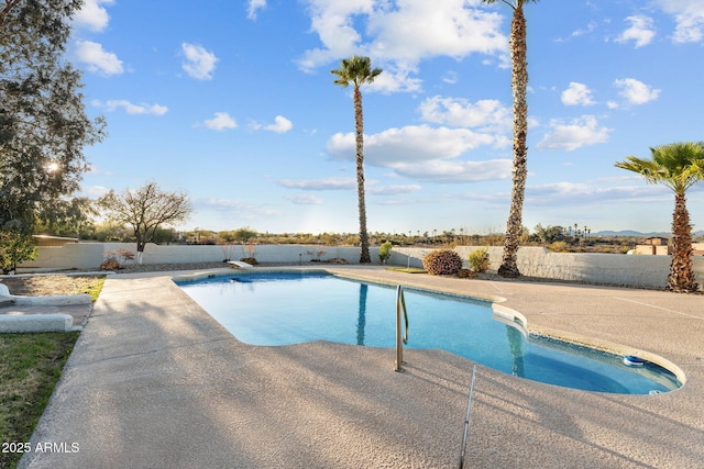 view of swimming pool with a patio area, a fenced in pool, and a fenced backyard