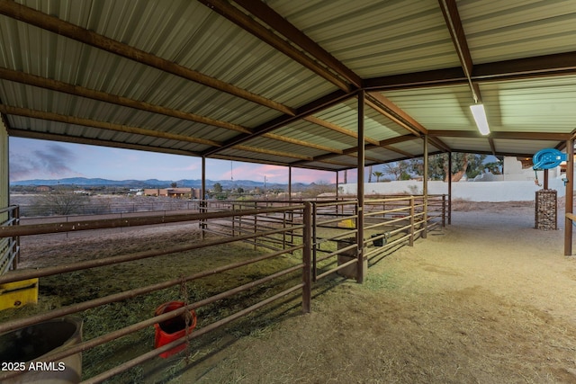 view of horse barn featuring a rural view