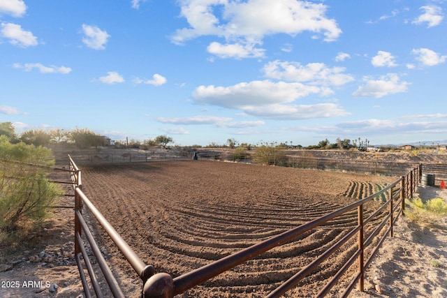 view of yard featuring an enclosed area and a rural view