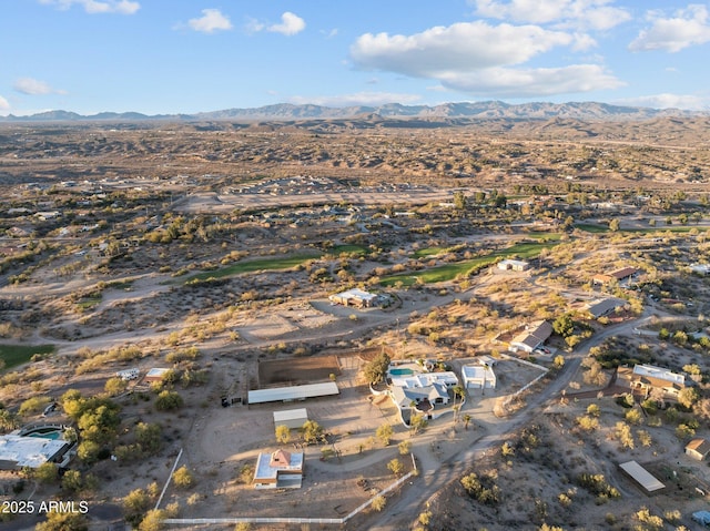 birds eye view of property with a mountain view