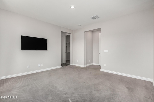 unfurnished bedroom featuring baseboards, carpet flooring, recessed lighting, and a closet