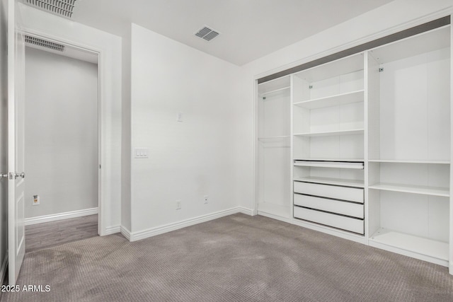 unfurnished bedroom with carpet, baseboards, and a closet