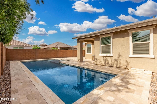 view of pool featuring a patio and a fenced backyard