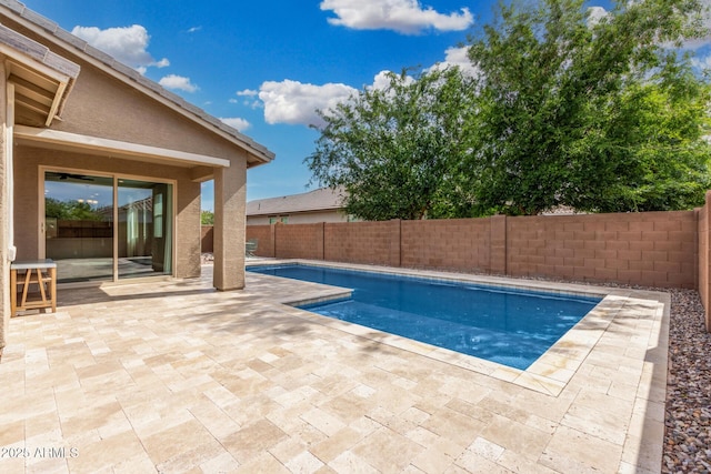view of pool with a fenced backyard and a patio area