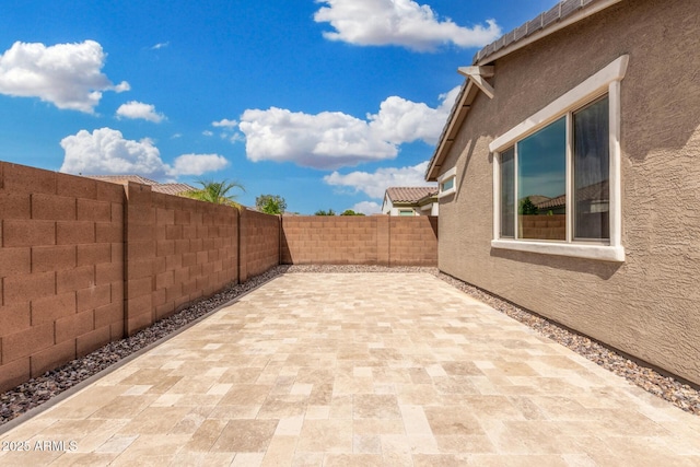 view of patio featuring a fenced backyard