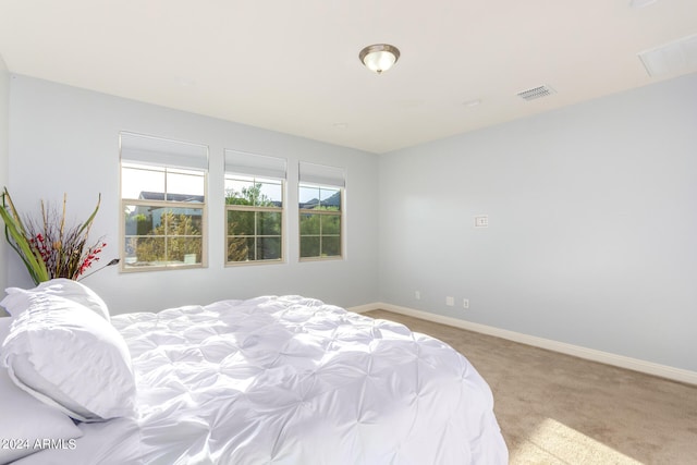 bedroom with light carpet