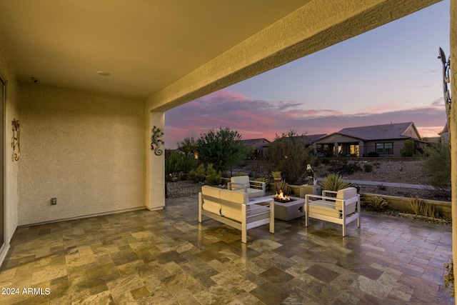 view of patio terrace at dusk