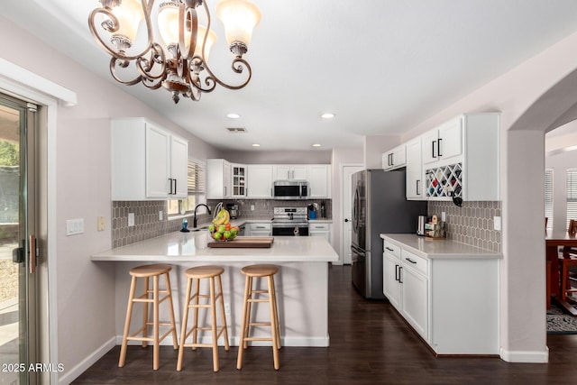 kitchen featuring light countertops, a healthy amount of sunlight, visible vents, and appliances with stainless steel finishes
