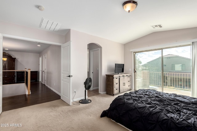 bedroom featuring visible vents, arched walkways, lofted ceiling, and access to outside