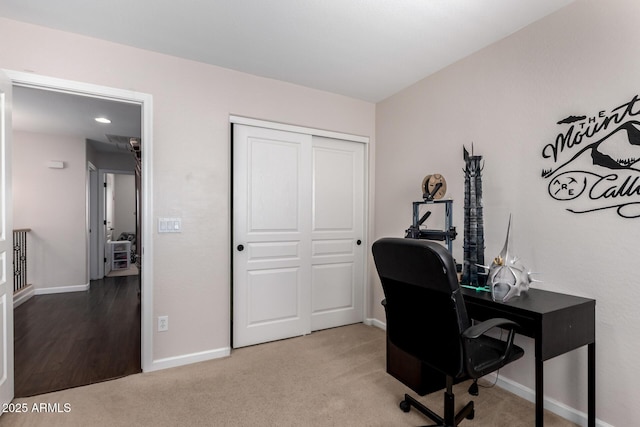 carpeted office space with baseboards