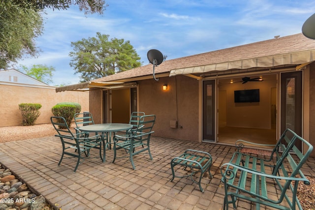 view of patio / terrace featuring outdoor dining space and fence